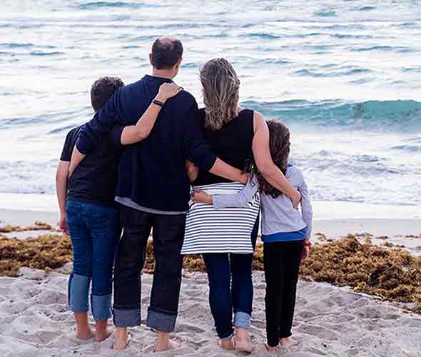 A photo of a family by the beach