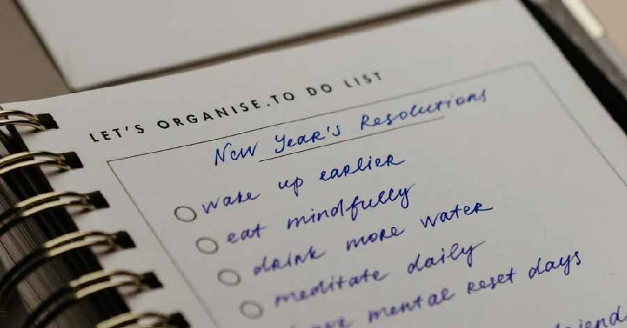 a to-do list with new year’s resolutions written down