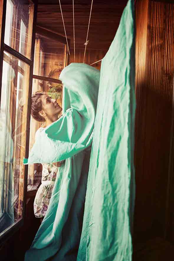 woman hanging green linen